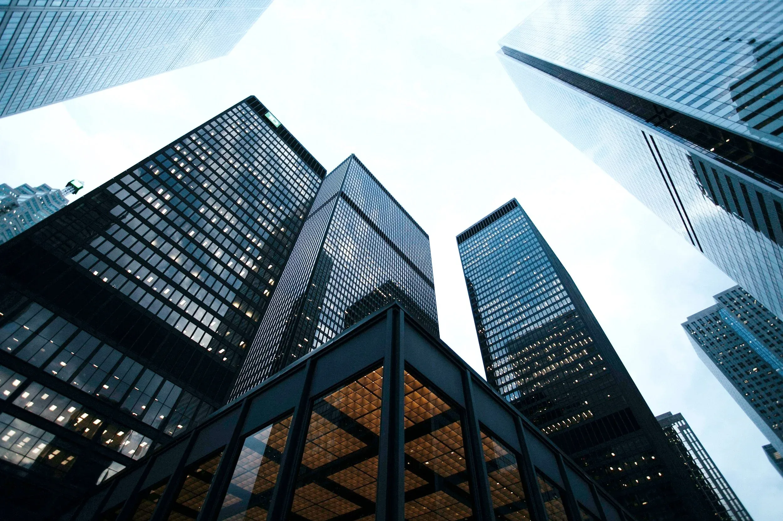Glass office towers viewed from below — BEO Investments