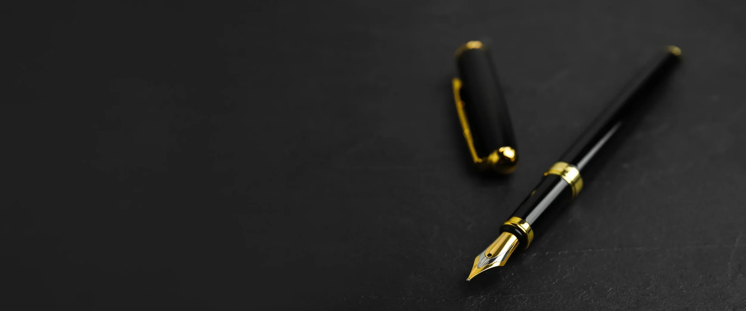 Fountain pen on a dark surface — BEO Investments